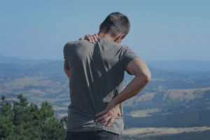 back pain in man standing still